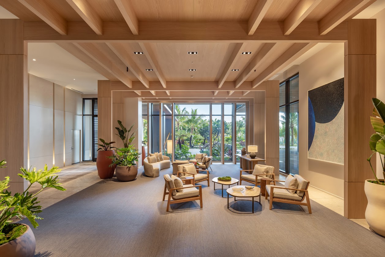 A spacious living room with wooden floors and furniture.